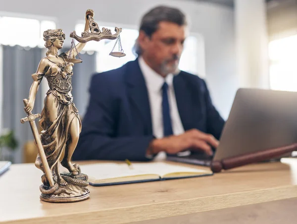 depositphotos_667613572-stock-photo-justice-statue-man-office-laptop